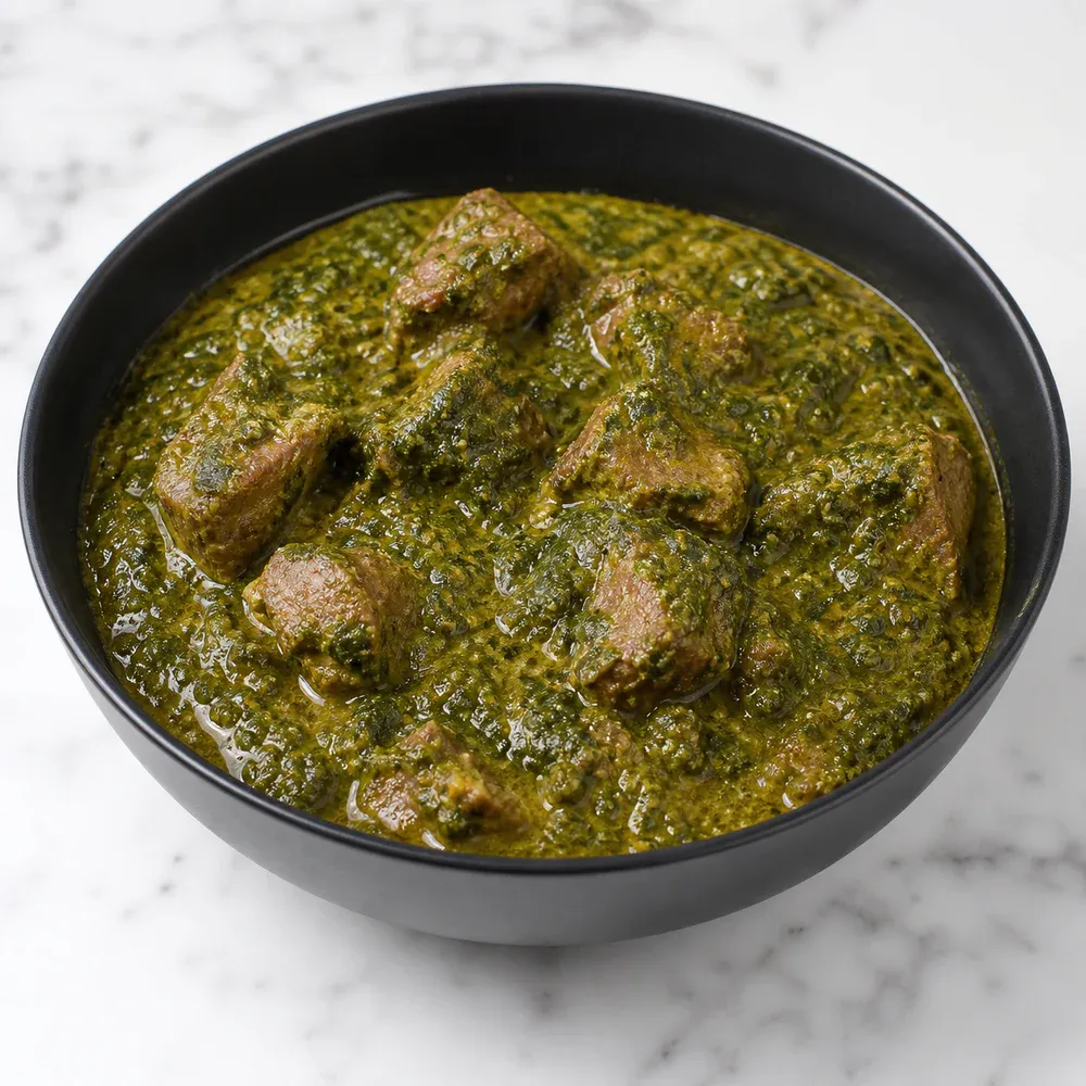 Lamb cubes cooked in a creamy spinach sauce.
