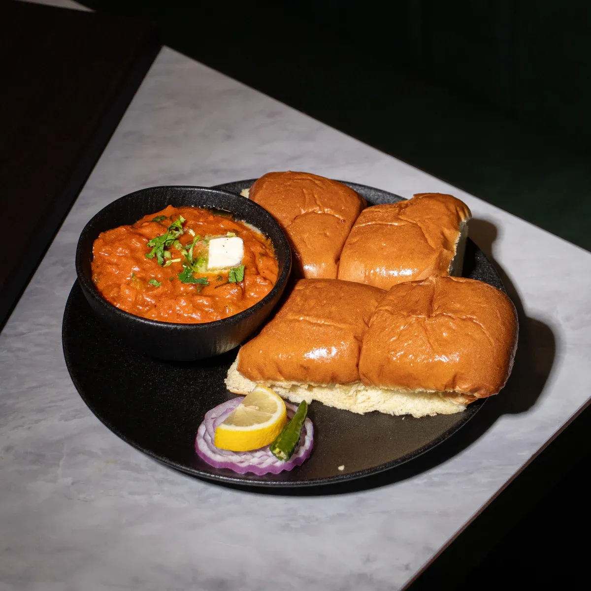 Bombay street food with slow-cooked chopped vegetables and in-house buns.